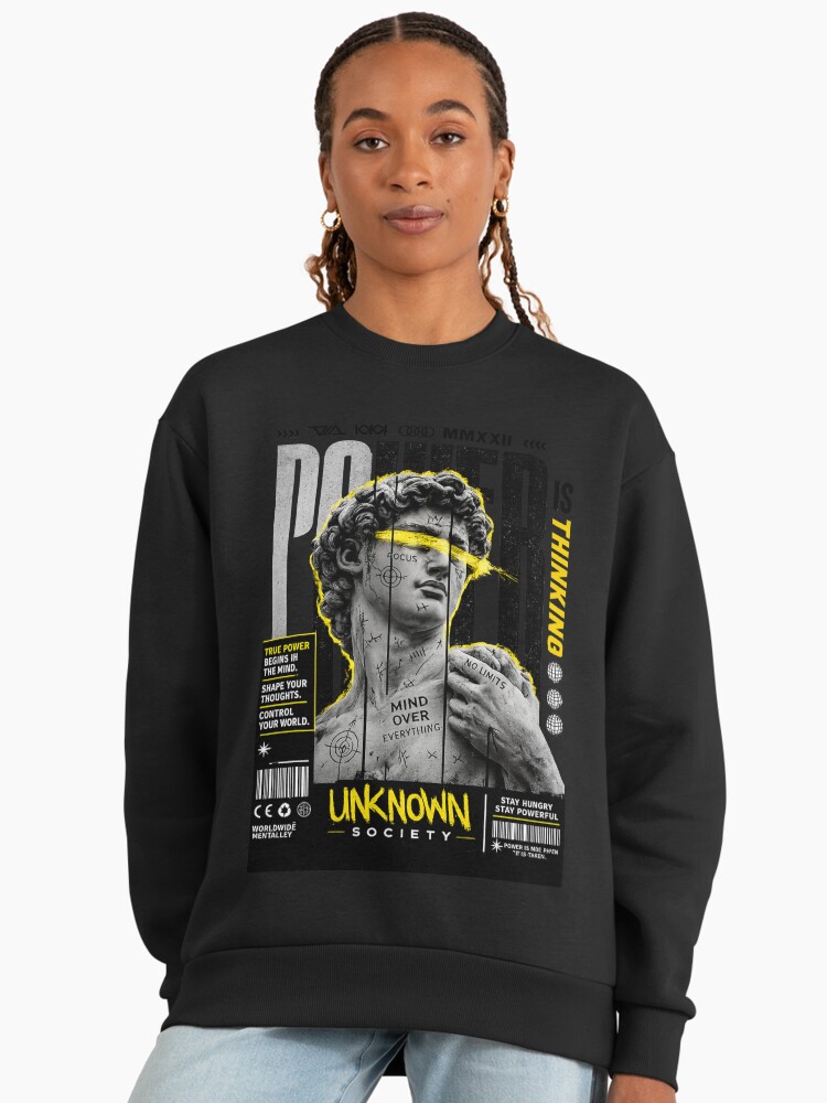 Customer wearing Unknown Society Power sweatshirt.